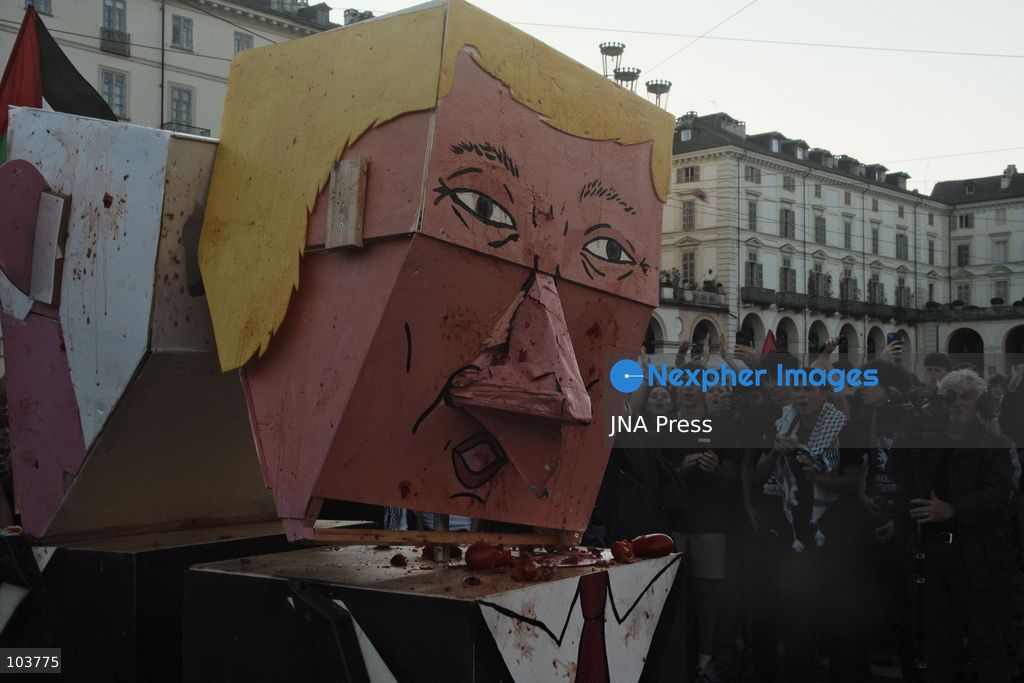TURIN, ITALY, OCTOBER 10, 2026: Thousands of pro-Palestinian demonstrators march through Turin during a protest organized by the Torino per Gaza coalition. Tensions erupted near Piazza Castello when police blocked access to the square, leading to clashes between demonstrators and riot police before some protesters were allowed to enter. Participants carried Palestinian flags and displayed effigies of Israeli Prime Minister Benjamin Netanyahu and US President Donald Trump as they marched through the city in support of Palestine. Photo by Julian Nelaj / JNA Press. (Photo by Julian Nelaj/JNA Press via Nexpher Images)