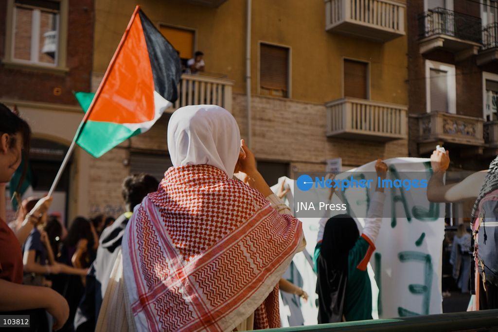 TURIN, ITALY, OCTOBER 10, 2026: Thousands of pro-Palestinian demonstrators march through central Turin during a regional protest organized by Torino per Gaza, as demonstrations take place across Italy in solidarity with Palestinians. Tensions erupted near Piazza Castello when protesters attempted to cross a police cordon, leading to brief confrontations before the march continued through the city. Demonstrators carried Palestinian flags and large effigies depicting US President Donald Trump and Israeli Prime Minister Benjamin Netanyahu. Toward the end of the demonstration, protesters threw tomatoes at the effigies before setting them on fire. Chiara Antenucci (Photo by Chiara Antenucci/JNA Press via Nexpher Images)