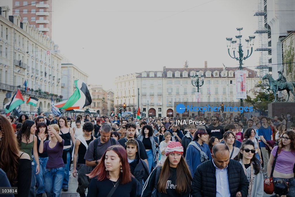 TURIN, ITALY, OCTOBER 10, 2026: Thousands of pro-Palestinian demonstrators march through central Turin during a regional protest organized by Torino per Gaza, as demonstrations take place across Italy in solidarity with Palestinians. Tensions erupted near Piazza Castello when protesters attempted to cross a police cordon, leading to brief confrontations before the march continued through the city. Demonstrators carried Palestinian flags and large effigies depicting US President Donald Trump and Israeli Prime Minister Benjamin Netanyahu. Toward the end of the demonstration, protesters threw tomatoes at the effigies before setting them on fire. Chiara Antenucci (Photo by Chiara Antenucci/JNA Press via Nexpher Images)