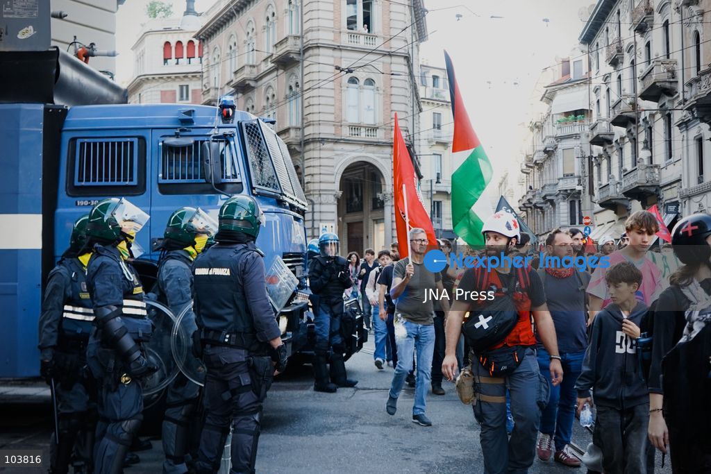 TURIN, ITALY, OCTOBER 10, 2026: Thousands of pro-Palestinian demonstrators march through central Turin during a regional protest organized by Torino per Gaza, as demonstrations take place across Italy in solidarity with Palestinians. Tensions erupted near Piazza Castello when protesters attempted to cross a police cordon, leading to brief confrontations before the march continued through the city. Demonstrators carried Palestinian flags and large effigies depicting US President Donald Trump and Israeli Prime Minister Benjamin Netanyahu. Toward the end of the demonstration, protesters threw tomatoes at the effigies before setting them on fire. Chiara Antenucci (Photo by Chiara Antenucci/JNA Press via Nexpher Images)