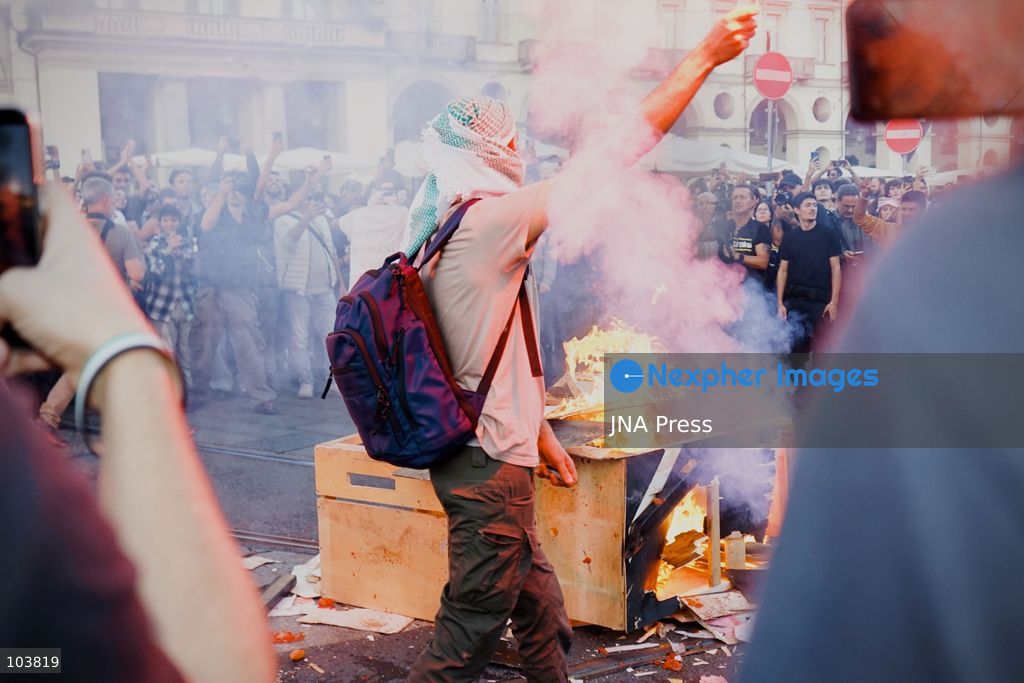 TURIN, ITALY, OCTOBER 10, 2026: Thousands of pro-Palestinian demonstrators march through central Turin during a regional protest organized by Torino per Gaza, as demonstrations take place across Italy in solidarity with Palestinians. Tensions erupted near Piazza Castello when protesters attempted to cross a police cordon, leading to brief confrontations before the march continued through the city. Demonstrators carried Palestinian flags and large effigies depicting US President Donald Trump and Israeli Prime Minister Benjamin Netanyahu. Toward the end of the demonstration, protesters threw tomatoes at the effigies before setting them on fire. Chiara Antenucci (Photo by Chiara Antenucci/JNA Press via Nexpher Images)