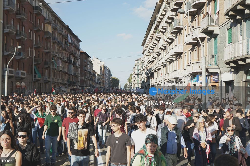 TURIN, ITALY, OCTOBER 10, 2026: Thousands of pro-Palestinian demonstrators march through central Turin during a regional protest organized by Torino per Gaza, as demonstrations take place across Italy in solidarity with Palestinians. Tensions erupted near Piazza Castello when protesters attempted to cross a police cordon, leading to brief confrontations before the march continued through the city. Demonstrators carried Palestinian flags and large effigies depicting US President Donald Trump and Israeli Prime Minister Benjamin Netanyahu. Toward the end of the demonstration, protesters threw tomatoes at the effigies before setting them on fire. Chiara Antenucci (Photo by Chiara Antenucci/JNA Press via Nexpher Images)