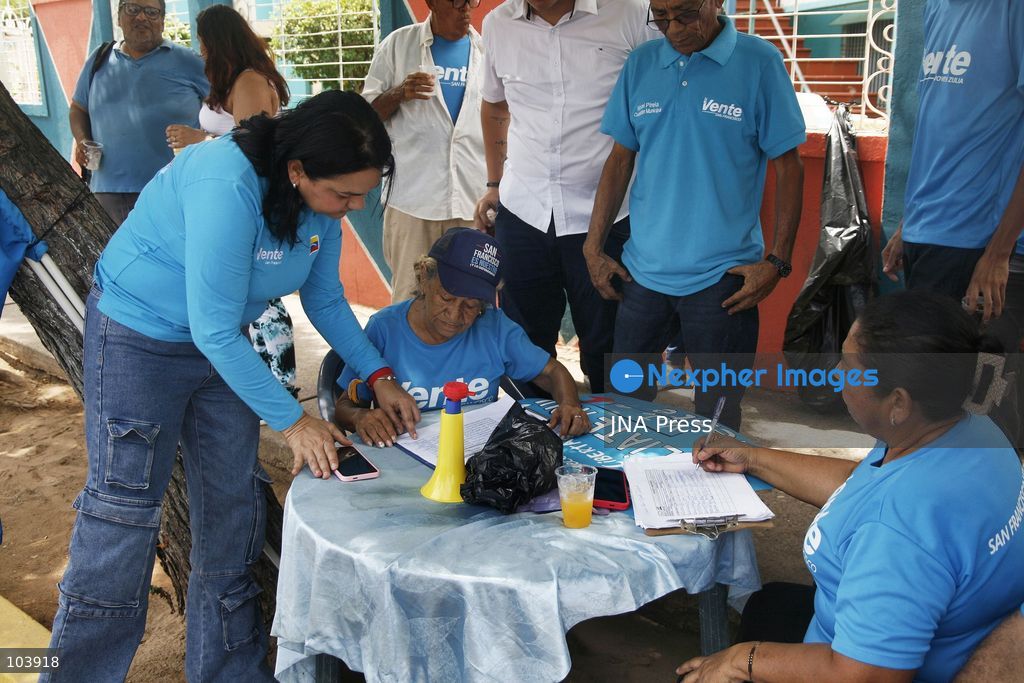 SAN FRANCISCO, ZULIA, VENEZUELA, OCTOBER 10, 2026: Members and supporters of the opposition party Vente Venezuela, led by Maria Corina Machado, take part in a membership registration campaign in San Francisco municipality, Zulia state. The initiative, called "Vente Toma el Zulia," aims to recruit new party members and strengthen the organization's presence across the state ahead of possible presidential elections in 2027. Party organizers said the campaign would take place across 109 parishes in Zulia. Photo by Humberto Matheus / JNA Press. (Photo by Humberto Matheus/JNA Press via Nexpher Images)