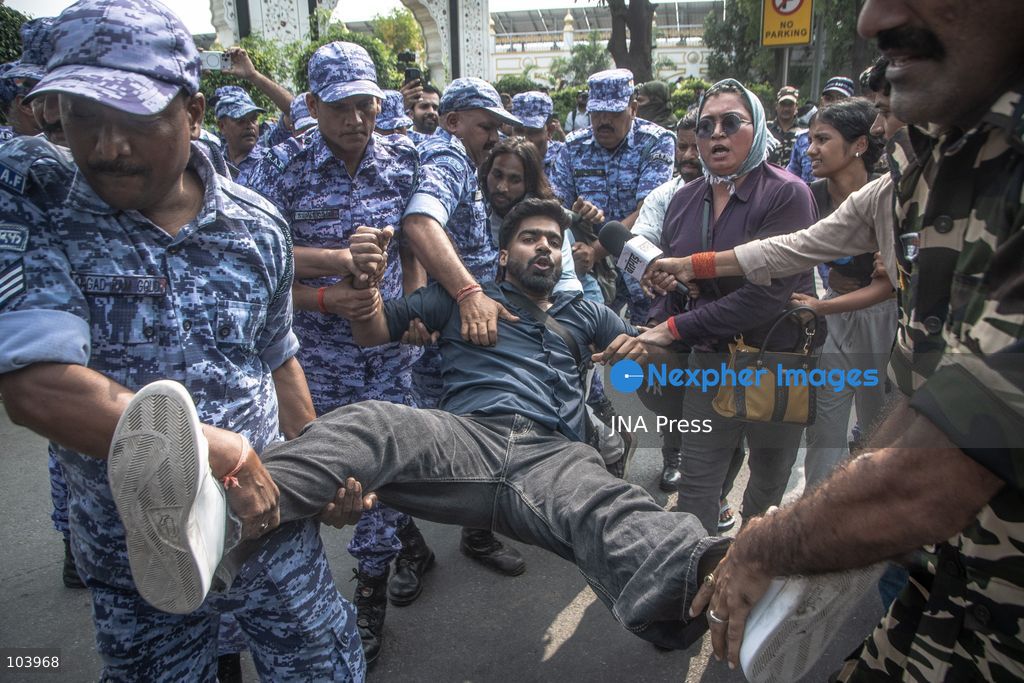 NEW DELHI, INDIA, OCTOBER 10, 2026: Police officers detain a protester during demonstrations organized by the Cockroach Janta Party (CJP) demanding the resignation of India's Chief Election Commissioner Gyanesh Kumar over alleged irregularities in electoral roll revisions. Indian authorities deployed thousands of security personnel and imposed restrictions across New Delhi to prevent protesters from gathering at Jantar Mantar. Thousands of demonstrators and activists were detained during the police operation. Photo by Amit Shukla / JNA Press. (Photo by Amit shukla/JNA Press via Nexpher Images)