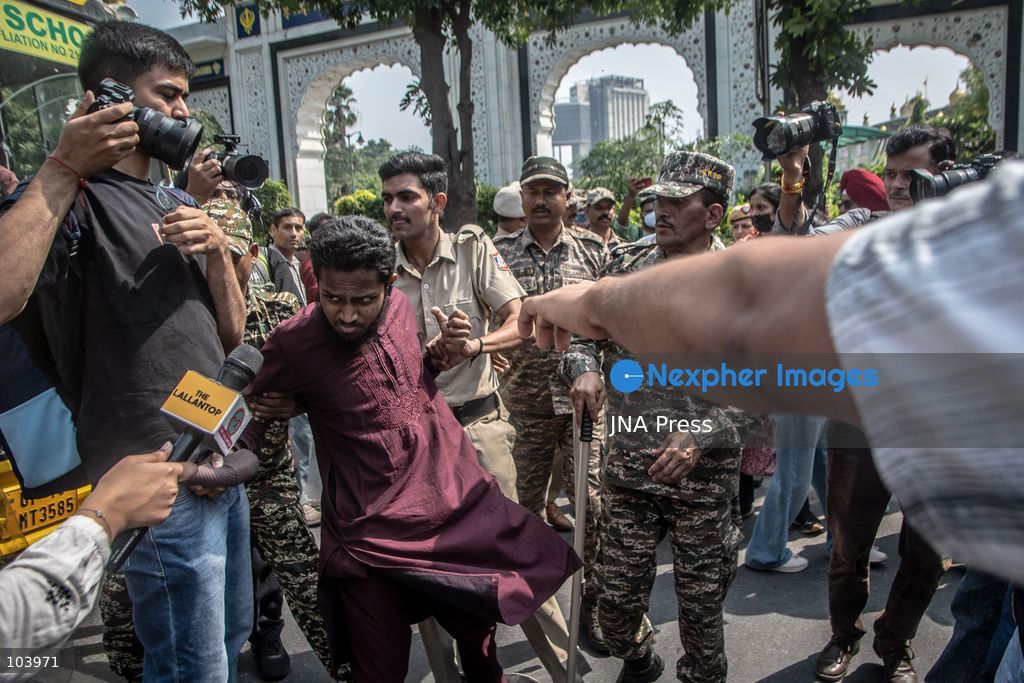 NEW DELHI, INDIA, OCTOBER 10, 2026: Police officers detain a protester during demonstrations organized by the Cockroach Janta Party (CJP) demanding the resignation of India's Chief Election Commissioner Gyanesh Kumar over alleged irregularities in electoral roll revisions. Indian authorities deployed thousands of security personnel and imposed restrictions across New Delhi to prevent protesters from gathering at Jantar Mantar. Thousands of demonstrators and activists were detained during the police operation. Photo by Amit Shukla / JNA Press. (Photo by Amit shukla/JNA Press via Nexpher Images)