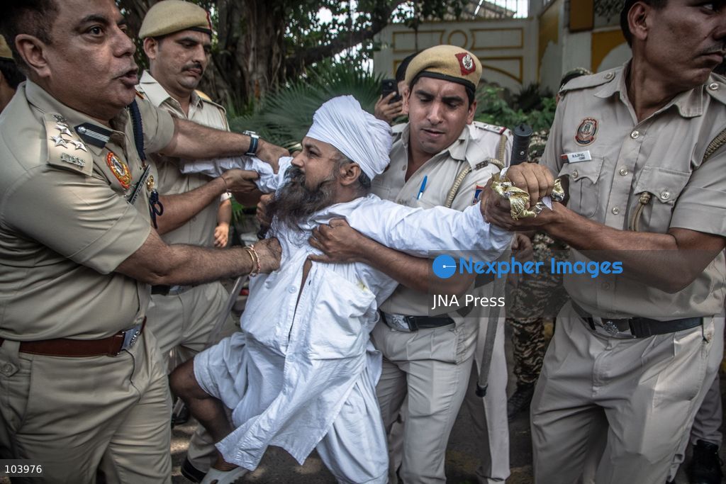 NEW DELHI, INDIA, OCTOBER 10, 2026: Police officers detain a protester during demonstrations organized by the Cockroach Janta Party (CJP) demanding the resignation of India's Chief Election Commissioner Gyanesh Kumar over alleged irregularities in electoral roll revisions. Indian authorities deployed thousands of security personnel and imposed restrictions across New Delhi to prevent protesters from gathering at Jantar Mantar. Thousands of demonstrators and activists were detained during the police operation. Photo by Amit Shukla / JNA Press. (Photo by Amit shukla/JNA Press via Nexpher Images)