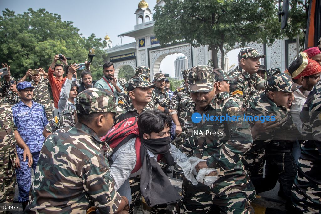 NEW DELHI, INDIA, OCTOBER 10, 2026: Police officers detain a protester during demonstrations organized by the Cockroach Janta Party (CJP) demanding the resignation of India's Chief Election Commissioner Gyanesh Kumar over alleged irregularities in electoral roll revisions. Indian authorities deployed thousands of security personnel and imposed restrictions across New Delhi to prevent protesters from gathering at Jantar Mantar. Thousands of demonstrators and activists were detained during the police operation. Photo by Amit Shukla / JNA Press. (Photo by Amit shukla/JNA Press via Nexpher Images)