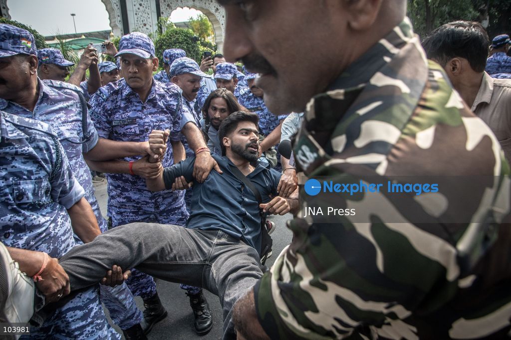 NEW DELHI, INDIA, OCTOBER 10, 2026: Police officers detain a protester during demonstrations organized by the Cockroach Janta Party (CJP) demanding the resignation of India's Chief Election Commissioner Gyanesh Kumar over alleged irregularities in electoral roll revisions. Indian authorities deployed thousands of security personnel and imposed restrictions across New Delhi to prevent protesters from gathering at Jantar Mantar. Thousands of demonstrators and activists were detained during the police operation. Photo by Amit Shukla / JNA Press. (Photo by Amit shukla/JNA Press via Nexpher Images)