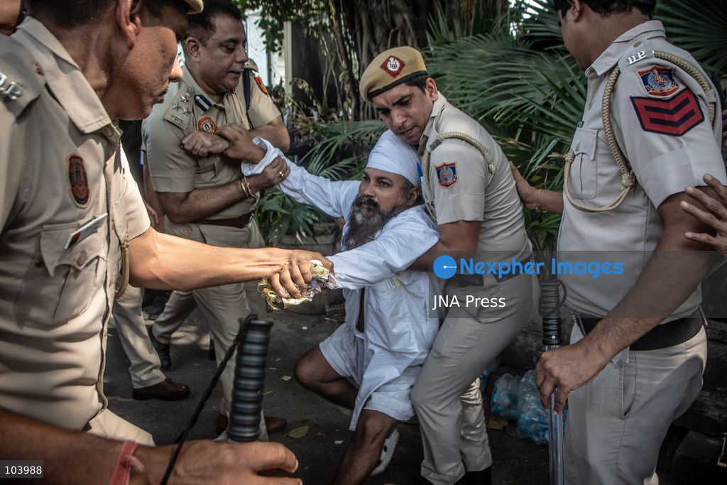 NEW DELHI, INDIA, OCTOBER 10, 2026: Police officers detain a protester during demonstrations organized by the Cockroach Janta Party (CJP) demanding the resignation of India's Chief Election Commissioner Gyanesh Kumar over alleged irregularities in electoral roll revisions. Indian authorities deployed thousands of security personnel and imposed restrictions across New Delhi to prevent protesters from gathering at Jantar Mantar. Thousands of demonstrators and activists were detained during the police operation. Photo by Amit Shukla / JNA Press. (Photo by Amit shukla/JNA Press via Nexpher Images)