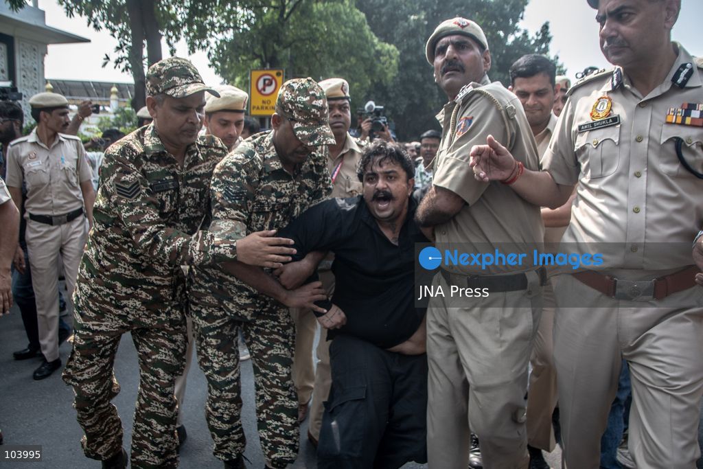 NEW DELHI, INDIA, OCTOBER 10, 2026: Police officers detain a protester during demonstrations organized by the Cockroach Janta Party (CJP) demanding the resignation of India's Chief Election Commissioner Gyanesh Kumar over alleged irregularities in electoral roll revisions. Indian authorities deployed thousands of security personnel and imposed restrictions across New Delhi to prevent protesters from gathering at Jantar Mantar. Thousands of demonstrators and activists were detained during the police operation. Photo by Amit Shukla / JNA Press. (Photo by Amit shukla/JNA Press via Nexpher Images)