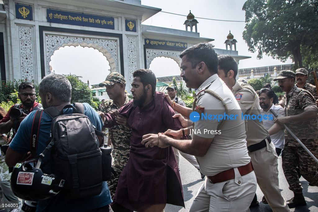 NEW DELHI, INDIA, OCTOBER 10, 2026: Police officers detain a protester during demonstrations organized by the Cockroach Janta Party (CJP) demanding the resignation of India's Chief Election Commissioner Gyanesh Kumar over alleged irregularities in electoral roll revisions. Indian authorities deployed thousands of security personnel and imposed restrictions across New Delhi to prevent protesters from gathering at Jantar Mantar. Thousands of demonstrators and activists were detained during the police operation. Photo by Amit Shukla / JNA Press. (Photo by Amit shukla/JNA Press via Nexpher Images)