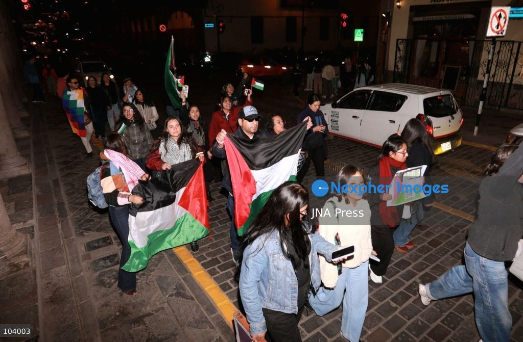 CUSCO, PERU, OCTOBER 11, 2026 : Around 40 protesters, including local residents and foreign nationals, march through the historic center of Cusco as part of the Global Action for Palestine, a coordinated international day of demonstrations. Participants called on the Peruvian government to sever diplomatic relations and military-related ties with Israel. Demonstrators also urged regional authorities to address concerns over the presence of Israeli soldiers visiting Cusco and surrounding areas, while expressing solidarity with Palestinians amid Israel's military operations. Photo by Erick Diaz/ JNA Press. (Photo by Erick Diaz Veliz/JNA Press via Nexpher Images)
