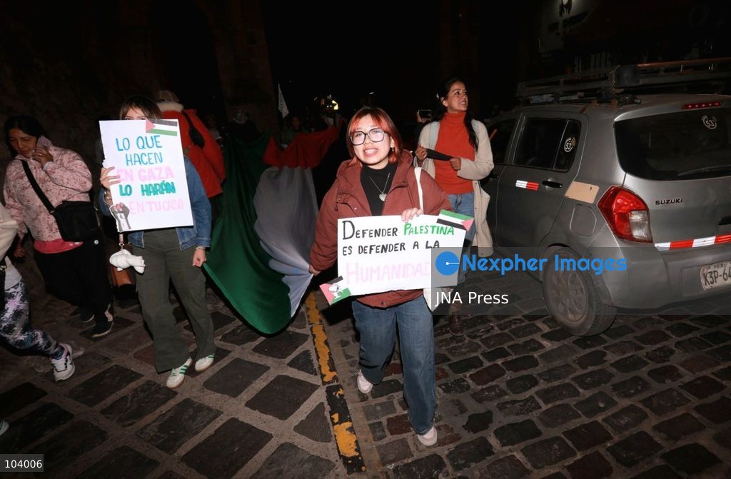CUSCO, PERU, OCTOBER 11, 2026 : Around 40 protesters, including local residents and foreign nationals, march through the historic center of Cusco as part of the Global Action for Palestine, a coordinated international day of demonstrations. Participants called on the Peruvian government to sever diplomatic relations and military-related ties with Israel. Demonstrators also urged regional authorities to address concerns over the presence of Israeli soldiers visiting Cusco and surrounding areas, while expressing solidarity with Palestinians amid Israel's military operations. Photo by Erick Diaz/ JNA Press. (Photo by Erick Diaz Veliz/JNA Press via Nexpher Images)