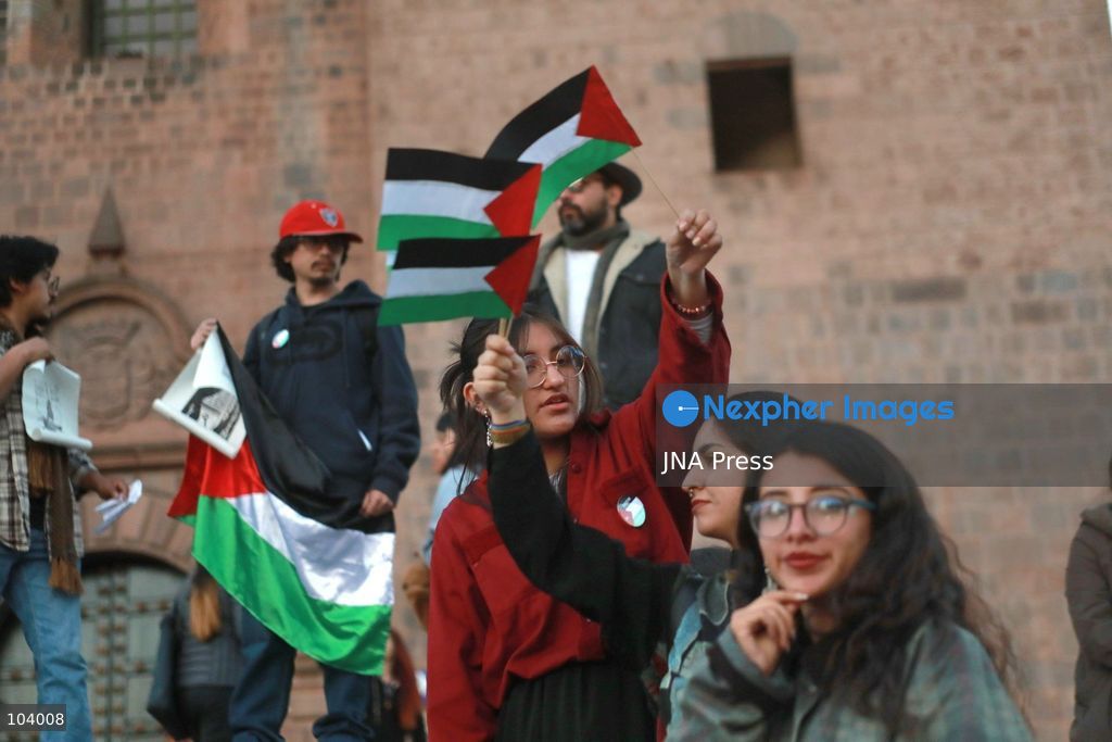 CUSCO, PERU, OCTOBER 11, 2026 : Around 40 protesters, including local residents and foreign nationals, march through the historic center of Cusco as part of the Global Action for Palestine, a coordinated international day of demonstrations. Participants called on the Peruvian government to sever diplomatic relations and military-related ties with Israel. Demonstrators also urged regional authorities to address concerns over the presence of Israeli soldiers visiting Cusco and surrounding areas, while expressing solidarity with Palestinians amid Israel's military operations. Photo by Erick Diaz/ JNA Press. (Photo by Erick Diaz Veliz/JNA Press via Nexpher Images)