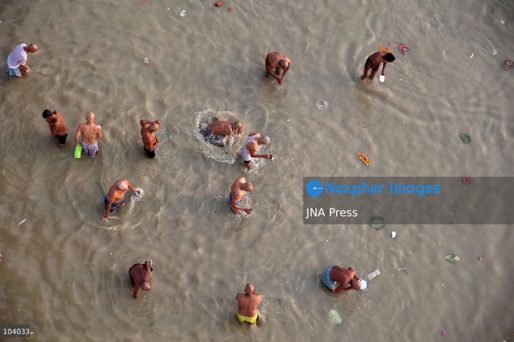 PRAYAGRAJ, INDIA, OCTOBER 11, 2026: Hindu devotees take a holy dip in the Ganga River at Phaphamau in Prayagraj, Uttar Pradesh, on the first day of the nine-day Navratri festival. The religious festival is dedicated to the worship of the Hindu goddess Durga and her nine forms, with devotees observing prayers, fasting and traditional rituals throughout the celebrations. Photo by Jitendra Prakash / JNA Press. (Photo by Jitendra Prakash/JNA Press via Nexpher Images)