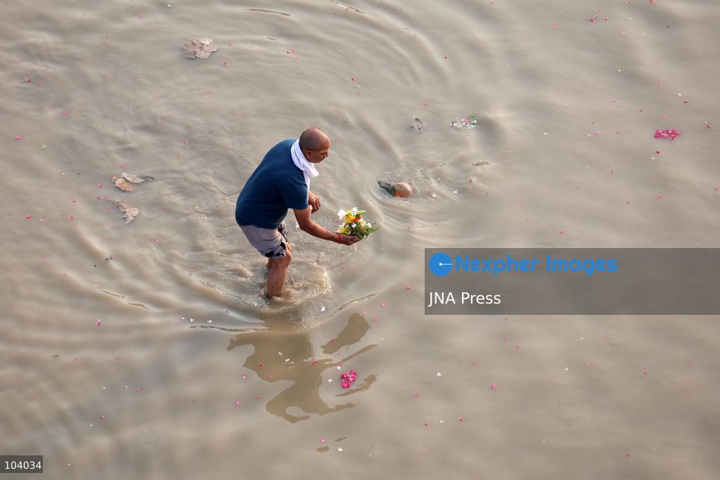 PRAYAGRAJ, INDIA, OCTOBER 11, 2026: Hindu devotees take a holy dip in the Ganga River at Phaphamau in Prayagraj, Uttar Pradesh, on the first day of the nine-day Navratri festival. The religious festival is dedicated to the worship of the Hindu goddess Durga and her nine forms, with devotees observing prayers, fasting and traditional rituals throughout the celebrations. Photo by Jitendra Prakash / JNA Press. (Photo by Jitendra Prakash/JNA Press via Nexpher Images)