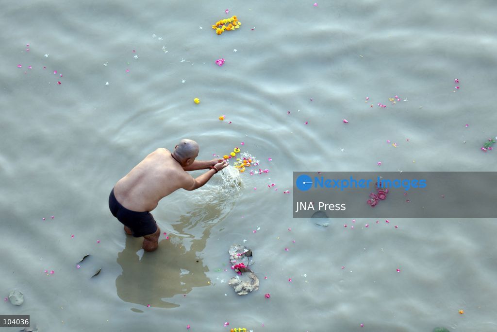 PRAYAGRAJ, INDIA, OCTOBER 11, 2026: Hindu devotees take a holy dip in the Ganga River at Phaphamau in Prayagraj, Uttar Pradesh, on the first day of the nine-day Navratri festival. The religious festival is dedicated to the worship of the Hindu goddess Durga and her nine forms, with devotees observing prayers, fasting and traditional rituals throughout the celebrations. Photo by Jitendra Prakash / JNA Press. (Photo by Jitendra Prakash/JNA Press via Nexpher Images)