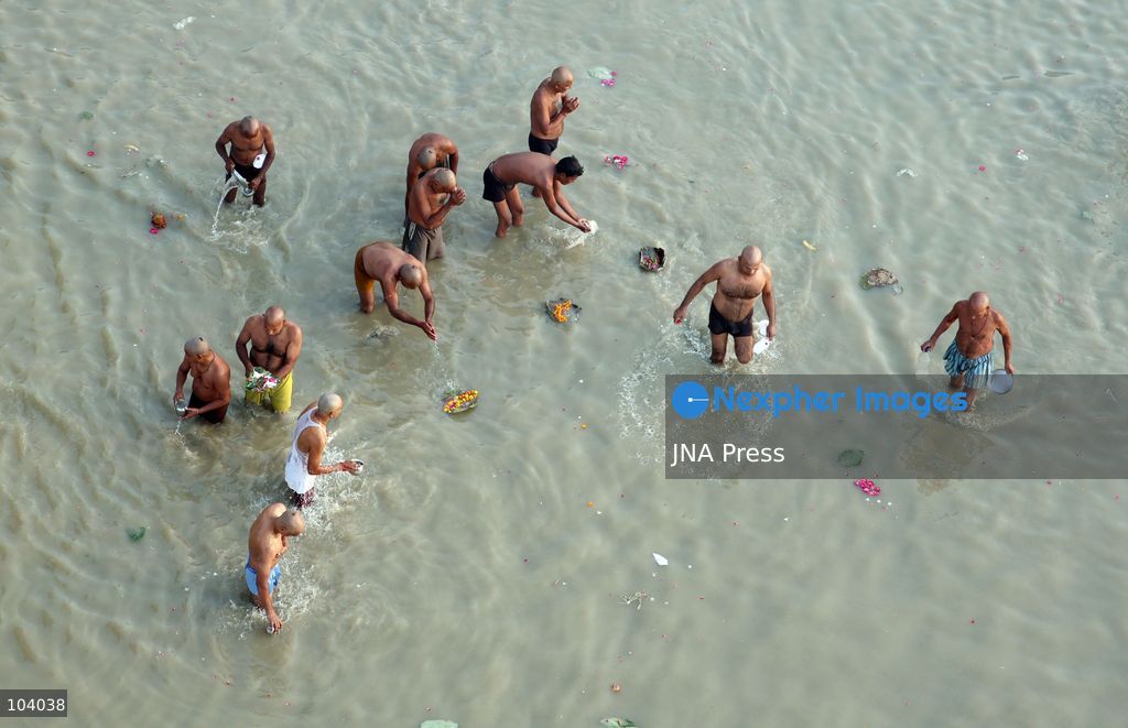 PRAYAGRAJ, INDIA, OCTOBER 11, 2026: Hindu devotees take a holy dip in the Ganga River at Phaphamau in Prayagraj, Uttar Pradesh, on the first day of the nine-day Navratri festival. The religious festival is dedicated to the worship of the Hindu goddess Durga and her nine forms, with devotees observing prayers, fasting and traditional rituals throughout the celebrations. Photo by Jitendra Prakash / JNA Press. (Photo by Jitendra Prakash/JNA Press via Nexpher Images)