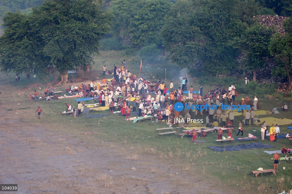 PRAYAGRAJ, INDIA, OCTOBER 11, 2026: Hindu devotees take a holy dip in the Ganga River at Phaphamau in Prayagraj, Uttar Pradesh, on the first day of the nine-day Navratri festival. The religious festival is dedicated to the worship of the Hindu goddess Durga and her nine forms, with devotees observing prayers, fasting and traditional rituals throughout the celebrations. Photo by Jitendra Prakash / JNA Press. (Photo by Jitendra Prakash/JNA Press via Nexpher Images)