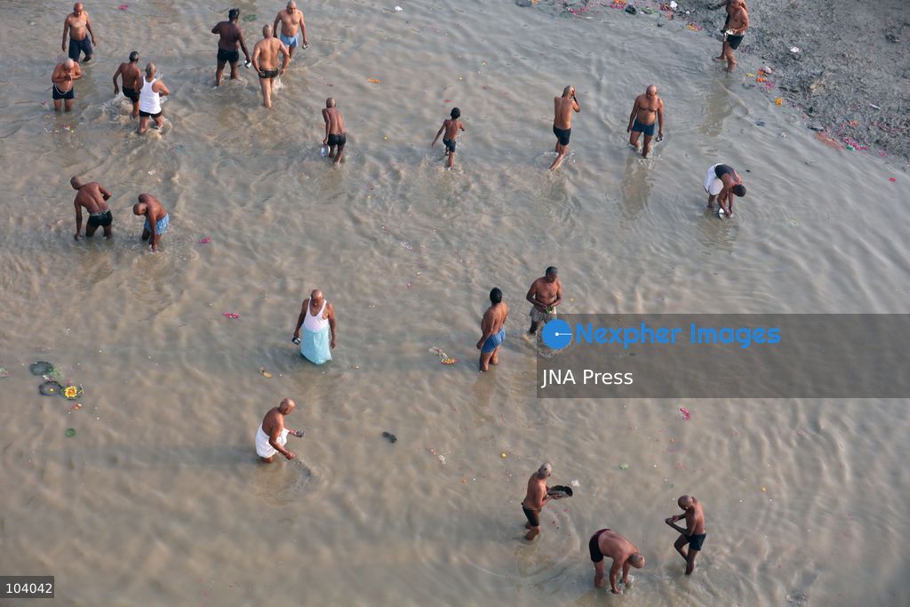 PRAYAGRAJ, INDIA, OCTOBER 11, 2026: Hindu devotees take a holy dip in the Ganga River at Phaphamau in Prayagraj, Uttar Pradesh, on the first day of the nine-day Navratri festival. The religious festival is dedicated to the worship of the Hindu goddess Durga and her nine forms, with devotees observing prayers, fasting and traditional rituals throughout the celebrations. Photo by Jitendra Prakash / JNA Press. (Photo by Jitendra Prakash/JNA Press via Nexpher Images)