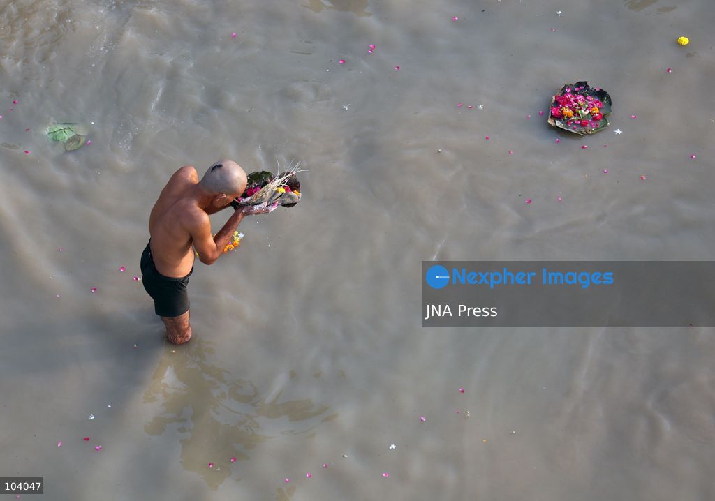 PRAYAGRAJ, INDIA, OCTOBER 11, 2026: Hindu devotees take a holy dip in the Ganga River at Phaphamau in Prayagraj, Uttar Pradesh, on the first day of the nine-day Navratri festival. The religious festival is dedicated to the worship of the Hindu goddess Durga and her nine forms, with devotees observing prayers, fasting and traditional rituals throughout the celebrations. Photo by Jitendra Prakash / JNA Press. (Photo by Jitendra Prakash/JNA Press via Nexpher Images)