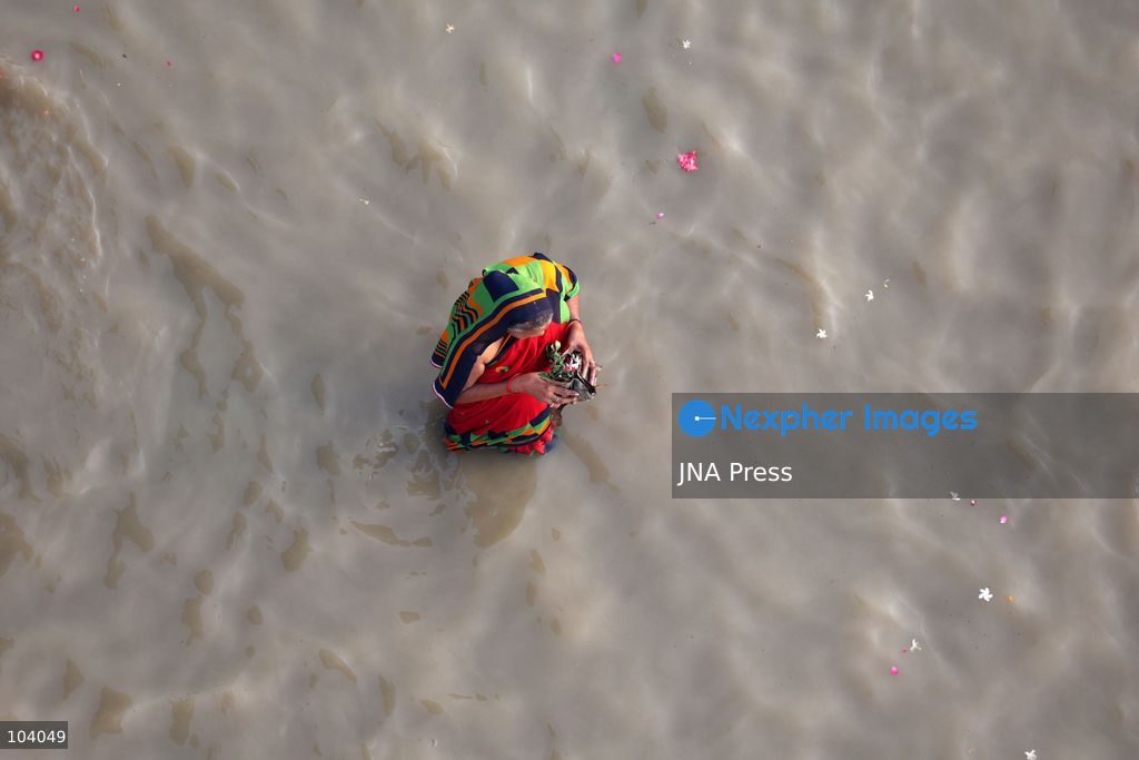 PRAYAGRAJ, INDIA, OCTOBER 11, 2026: Hindu devotees take a holy dip in the Ganga River at Phaphamau in Prayagraj, Uttar Pradesh, on the first day of the nine-day Navratri festival. The religious festival is dedicated to the worship of the Hindu goddess Durga and her nine forms, with devotees observing prayers, fasting and traditional rituals throughout the celebrations. Photo by Jitendra Prakash / JNA Press. (Photo by Jitendra Prakash/JNA Press via Nexpher Images)