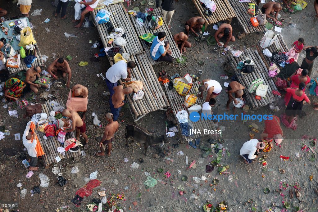 PRAYAGRAJ, INDIA, OCTOBER 11, 2026: Hindu devotees take a holy dip in the Ganga River at Phaphamau in Prayagraj, Uttar Pradesh, on the first day of the nine-day Navratri festival. The religious festival is dedicated to the worship of the Hindu goddess Durga and her nine forms, with devotees observing prayers, fasting and traditional rituals throughout the celebrations. Photo by Jitendra Prakash / JNA Press. (Photo by Jitendra Prakash/JNA Press via Nexpher Images)
