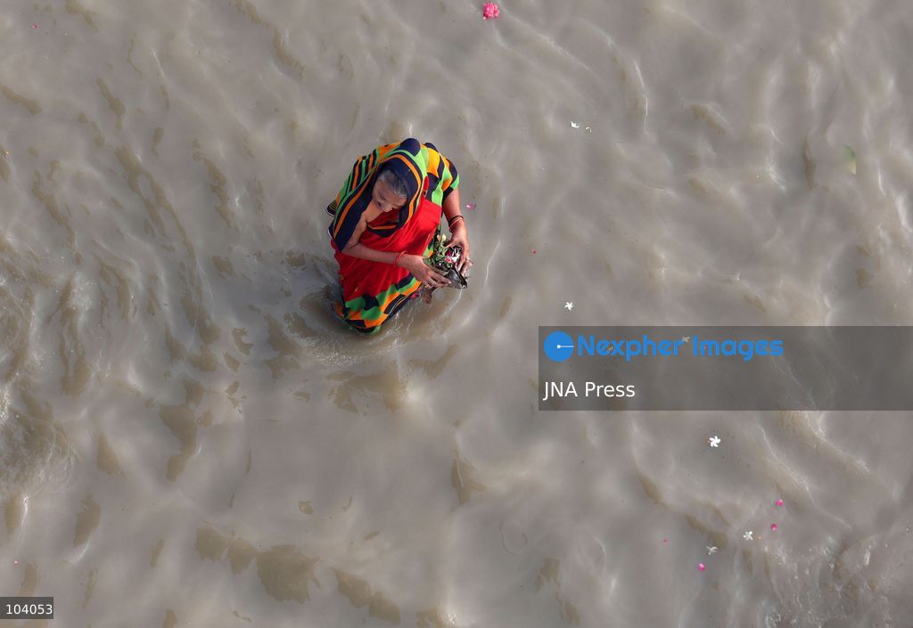 PRAYAGRAJ, INDIA, OCTOBER 11, 2026: Hindu devotees take a holy dip in the Ganga River at Phaphamau in Prayagraj, Uttar Pradesh, on the first day of the nine-day Navratri festival. The religious festival is dedicated to the worship of the Hindu goddess Durga and her nine forms, with devotees observing prayers, fasting and traditional rituals throughout the celebrations. Photo by Jitendra Prakash / JNA Press. (Photo by Jitendra Prakash/JNA Press via Nexpher Images)