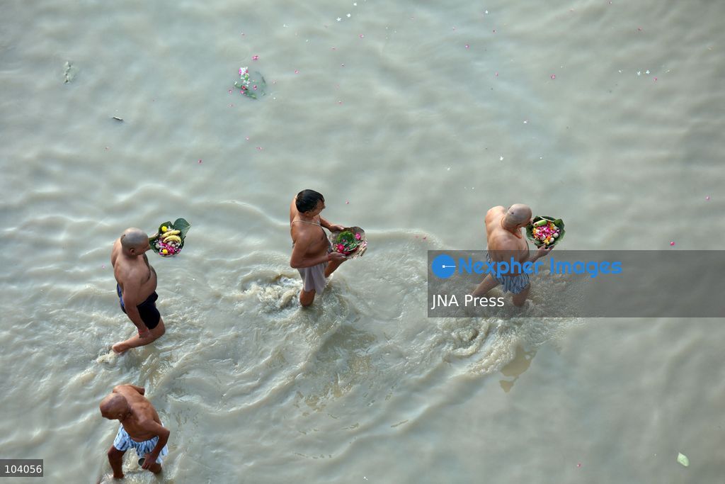 PRAYAGRAJ, INDIA, OCTOBER 11, 2026: Hindu devotees take a holy dip in the Ganga River at Phaphamau in Prayagraj, Uttar Pradesh, on the first day of the nine-day Navratri festival. The religious festival is dedicated to the worship of the Hindu goddess Durga and her nine forms, with devotees observing prayers, fasting and traditional rituals throughout the celebrations. Photo by Jitendra Prakash / JNA Press. (Photo by Jitendra Prakash/JNA Press via Nexpher Images)