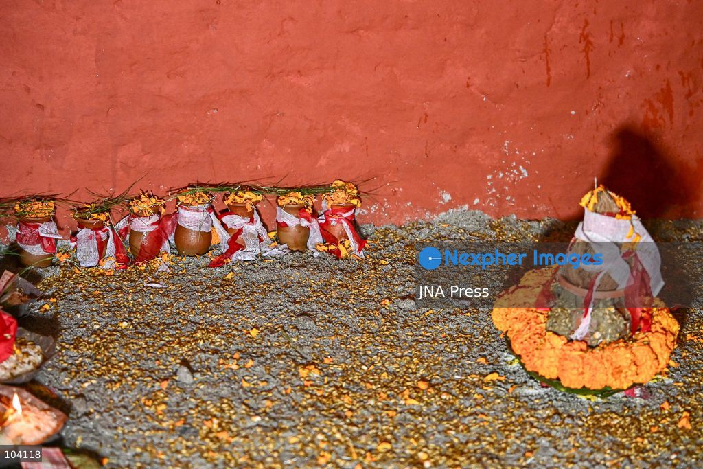 KATHMANDU, NEPAL, OCTOBER 11, 2026: A Hindu priest and Nepal Army personnel sow Jamara seeds during a Ghatasthapana ceremony marking the beginning of Dashain, Nepal's biggest Hindu festival, in Kathmandu. During the traditional ritual, barley and other grains are planted and kept away from sunlight to produce yellow shoots known as Jamara, which are later offered with tika as blessings during Bijaya Dashami. The 15-day Dashain festival began across Nepal as communities in Gorkha district faced disruption following severe flash flooding. Photo by Safal Prakash Shrestha / JNA Press. (Photo by Safal Prakash Shrestha/JNA Press via Nexpher Images)