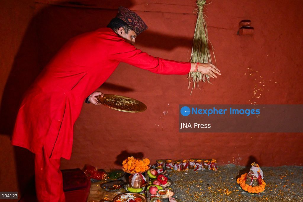 KATHMANDU, NEPAL, OCTOBER 11, 2026: A Hindu priest and Nepal Army personnel sow Jamara seeds during a Ghatasthapana ceremony marking the beginning of Dashain, Nepal's biggest Hindu festival, in Kathmandu. During the traditional ritual, barley and other grains are planted and kept away from sunlight to produce yellow shoots known as Jamara, which are later offered with tika as blessings during Bijaya Dashami. The 15-day Dashain festival began across Nepal as communities in Gorkha district faced disruption following severe flash flooding. Photo by Safal Prakash Shrestha / JNA Press. (Photo by Safal Prakash Shrestha/JNA Press via Nexpher Images)