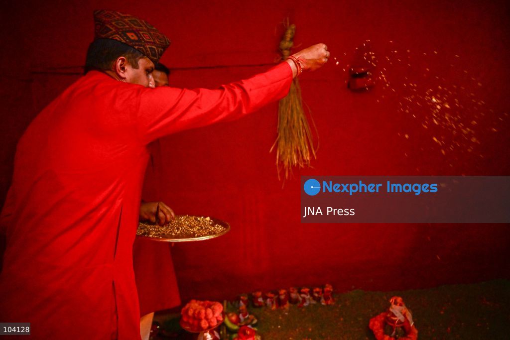 KATHMANDU, NEPAL, OCTOBER 11, 2026: A Hindu priest and Nepal Army personnel sow Jamara seeds during a Ghatasthapana ceremony marking the beginning of Dashain, Nepal's biggest Hindu festival, in Kathmandu. During the traditional ritual, barley and other grains are planted and kept away from sunlight to produce yellow shoots known as Jamara, which are later offered with tika as blessings during Bijaya Dashami. The 15-day Dashain festival began across Nepal as communities in Gorkha district faced disruption following severe flash flooding. Photo by Safal Prakash Shrestha / JNA Press. (Photo by Safal Prakash Shrestha/JNA Press via Nexpher Images)