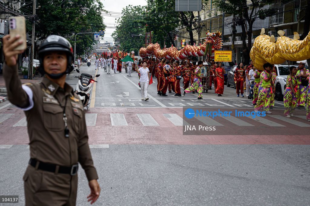 BANGKOK, THAILAND, OCTOBER 11, 2026: Devotees and performers take part in the annual deity procession organized by the Tiger God Shrine in Bangkok. The celebration features Chinese religious traditions including a procession of deities, Yingge performances, lion dances and dragon dances, as worshippers gather to pay respects and seek blessings. According to the shrine's tradition, the annual observance commemorates the day Tua Lao Eia Kong attained spiritual enlightenment. Photo by Watsawat Koktabtim / JNA Press. (Photo by Watsawat "James" Koktabtim/JNA Press via Nexpher Images)