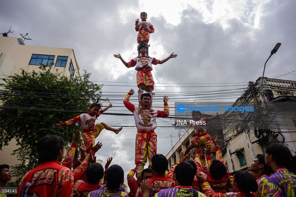 BANGKOK, THAILAND, OCTOBER 11, 2026: Devotees and performers take part in the annual deity procession organized by the Tiger God Shrine in Bangkok. The celebration features Chinese religious traditions including a procession of deities, Yingge performances, lion dances and dragon dances, as worshippers gather to pay respects and seek blessings. According to the shrine's tradition, the annual observance commemorates the day Tua Lao Eia Kong attained spiritual enlightenment. Photo by Watsawat Koktabtim / JNA Press. (Photo by Watsawat "James" Koktabtim/JNA Press via Nexpher Images)