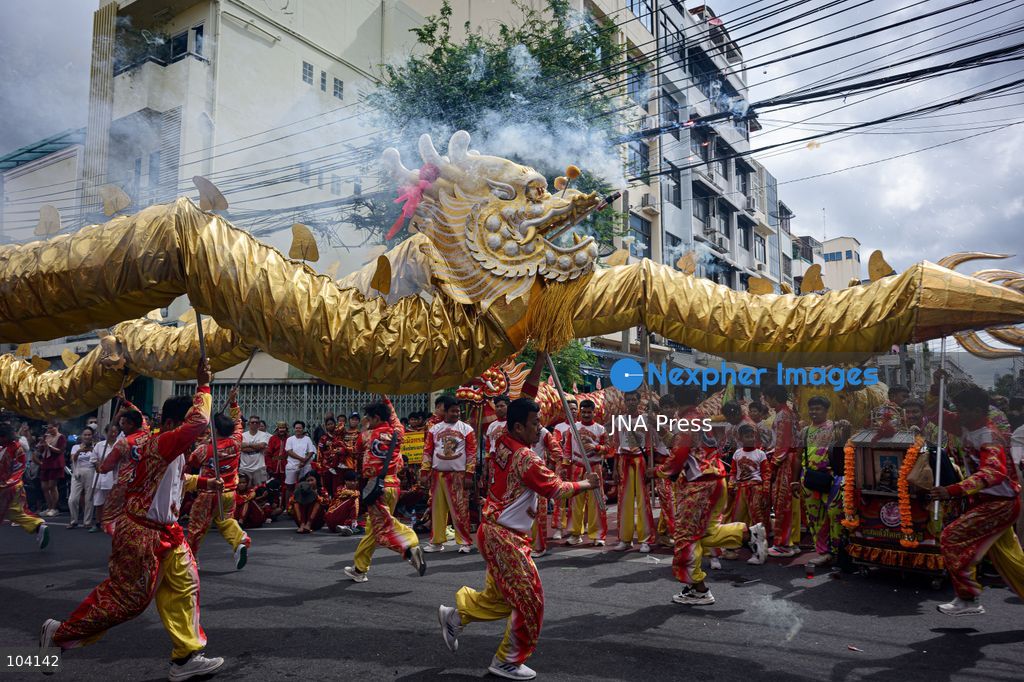 BANGKOK, THAILAND, OCTOBER 11, 2026: Devotees and performers take part in the annual deity procession organized by the Tiger God Shrine in Bangkok. The celebration features Chinese religious traditions including a procession of deities, Yingge performances, lion dances and dragon dances, as worshippers gather to pay respects and seek blessings. According to the shrine's tradition, the annual observance commemorates the day Tua Lao Eia Kong attained spiritual enlightenment. Photo by Watsawat Koktabtim / JNA Press. (Photo by Watsawat "James" Koktabtim/JNA Press via Nexpher Images)