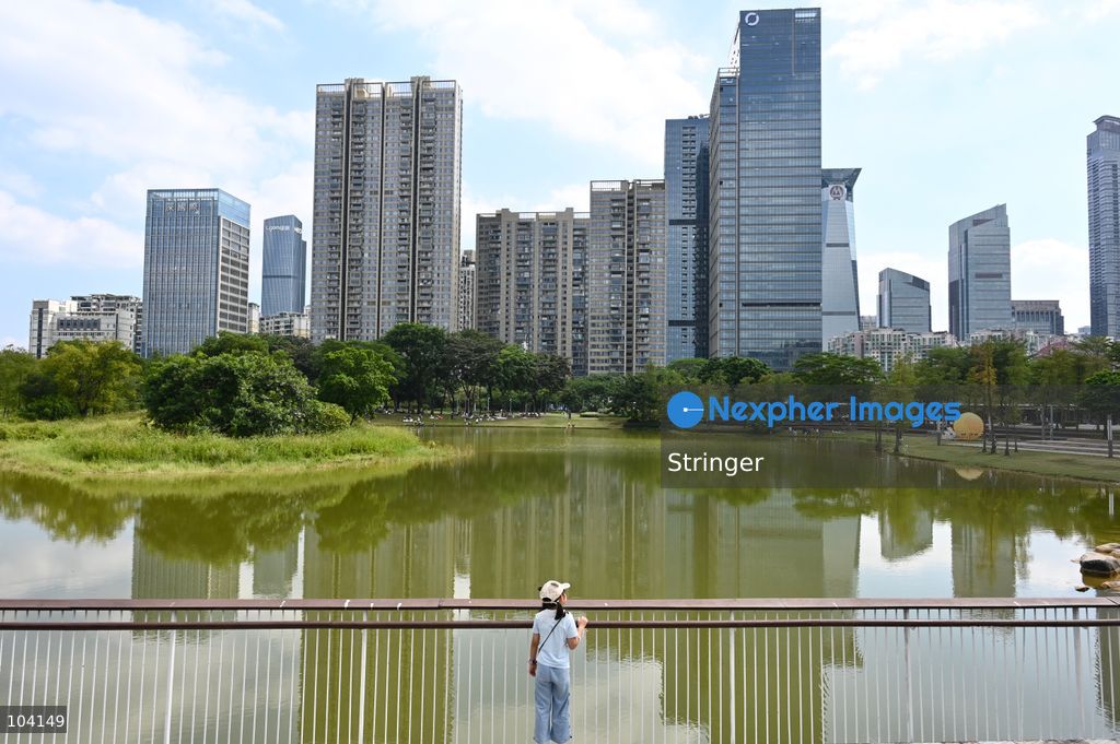 A child watching the Shenzhen city view at a park on October 11, 2026 in Shenzhen, China. (Photo by Stringer/Nexpher Images)