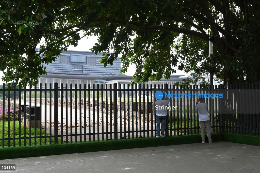 People taking photo with Shenzhen International Communication Center on October 11, 2026 in Shenzhen, China. The APEC Summit will be hold here in November. (Photo by Stringer/Nexpher Images)
