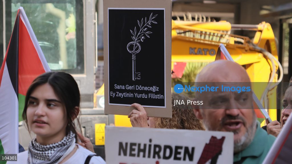 IZMIR, TURKEY, OCTOBER 11, 2026: Pro-Palestinian demonstrators gather outside the Turkan Saylan Cultural Center in Izmir during a protest organized by the local branch of the Association for the Freedom of Palestinians. Participants condemn Israeli military operations in Gaza and criticize US support for Israel, calling attention to Palestinian civilian casualties since October 7, 2023. The demonstration concludes at Gundogdu Square, where participants throw carnations into the sea in remembrance of Palestinians killed during the conflict. Photo by Turgay Kilic / JNA Press. (Photo by Turgay Kilic/JNA Press via Nexpher Images)