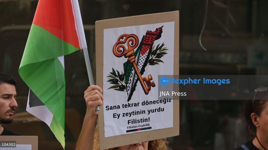 IZMIR, TURKEY, OCTOBER 11, 2026: Pro-Palestinian demonstrators gather outside the Turkan Saylan Cultural Center in Izmir during a protest organized by the local branch of the Association for the Freedom of Palestinians. Participants condemn Israeli military operations in Gaza and criticize US support for Israel, calling attention to Palestinian civilian casualties since October 7, 2023. The demonstration concludes at Gundogdu Square, where participants throw carnations into the sea in remembrance of Palestinians killed during the conflict. Photo by Turgay Kilic / JNA Press. (Photo by Turgay Kilic/JNA Press via Nexpher Images)
