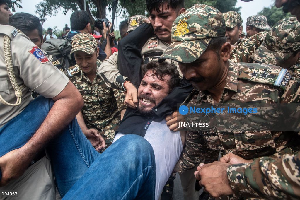 NEW DELHI, INDIA, OCTOBER 11, 2026: Police detain protesters during a demonstration at Connaught Place in New Delhi demanding the resignation of India's Chief Election Commissioner Gyanesh Kumar. The protests follow opposition allegations of irregularities in voter roll revisions, which the Election Commission denies. Photo by Amit Shukla / JNA Press. (Photo by Amit shukla/JNA Press via Nexpher Images)