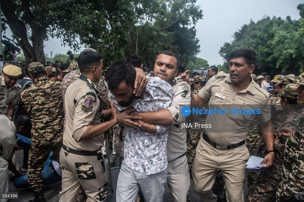 NEW DELHI, INDIA, OCTOBER 11, 2026: Police detain protesters during a demonstration at Connaught Place in New Delhi demanding the resignation of India's Chief Election Commissioner Gyanesh Kumar. The protests follow opposition allegations of irregularities in voter roll revisions, which the Election Commission denies. Photo by Amit Shukla / JNA Press. (Photo by Amit shukla/JNA Press via Nexpher Images)