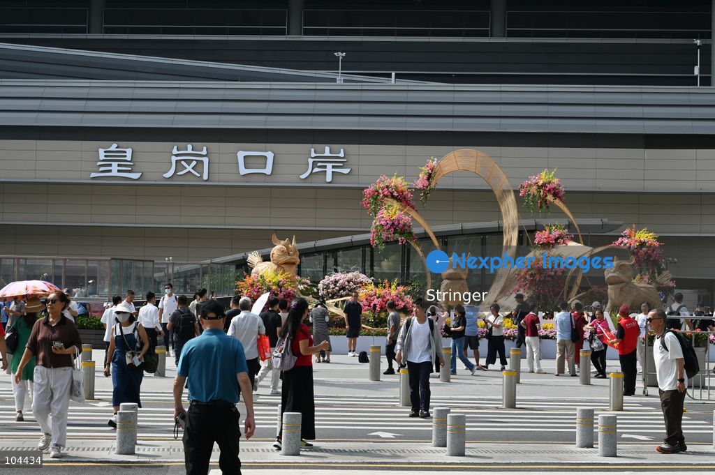 People walking outside of Huanggang Port on October 12, 2026 in Shenzhen, China. Huanggang Port officially opened for operation today. (Photo by Stringer/Nexpher Images)