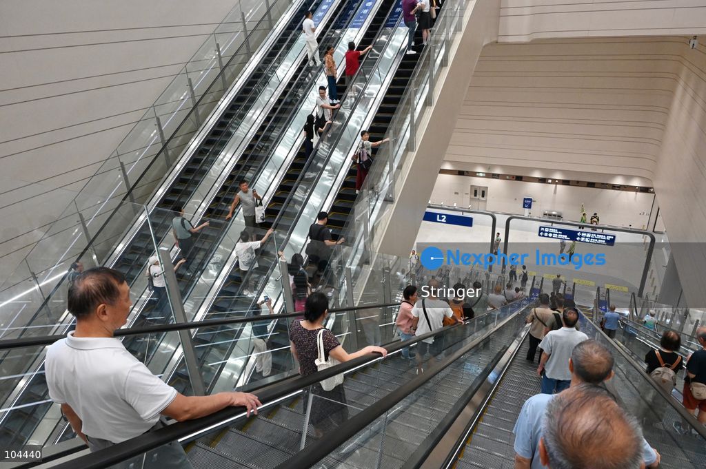 Tourists taking escalator at Huanggang Port on October 12, 2026 in Shenzhen, China. Huanggang Port officially opened for operation today. (Photo by Stringer/Nexpher Images)