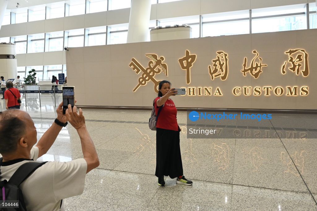 Tourists posing photo with China Customs logo at Huanggang Port on October 12, 2026 in Shenzhen, China. Huanggang Port officially opened for operation today. (Photo by Stringer/Nexpher Images)