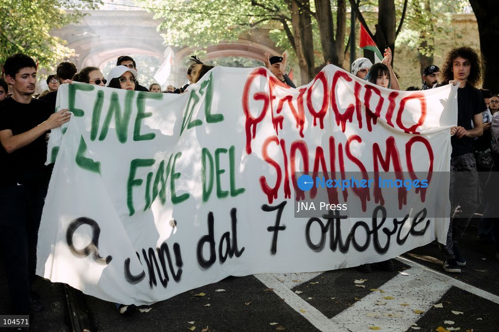 TURIN, ITALY, OCTOBER 10, 2026: Young protesters participate in a regional demonstration in support of Palestine, marching through the streets of Turin while holding a sign reading 'End to genocide / End to Zionism'. Photo by Luca Prestia / JNA Press (Photo by Luca Prestia/JNA Press via Nexpher Images)
