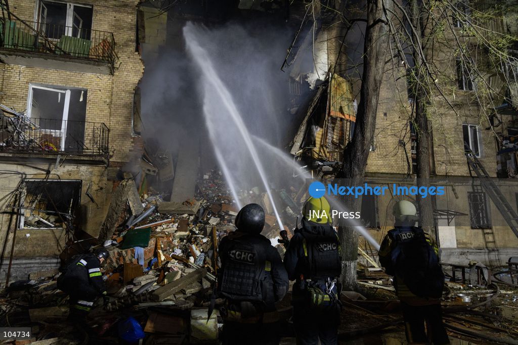 KHARKIV, UKRAINE, OCTOBER 12, 2026: Emergency workers conduct rescue operations at a residential building damaged in a Russian strike in Kharkiv's Kholodnohirskyi district. A firefighter was injured by falling concrete debris while clearing the rubble and was evacuated on a stretcher. Photo by Andrew Cling/ JNA Press. (Photo by Andrew Cling/JNA Press via Nexpher Images)