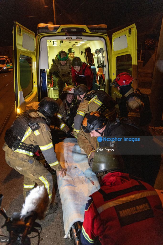 KHARKIV, UKRAINE, OCTOBER 12, 2026: Emergency workers conduct rescue operations at a residential building damaged in a Russian strike in Kharkiv's Kholodnohirskyi district. A firefighter was injured by falling concrete debris while clearing the rubble and was evacuated on a stretcher. Photo by Andrew Cling/ JNA Press. (Photo by Andrew Cling/JNA Press via Nexpher Images)