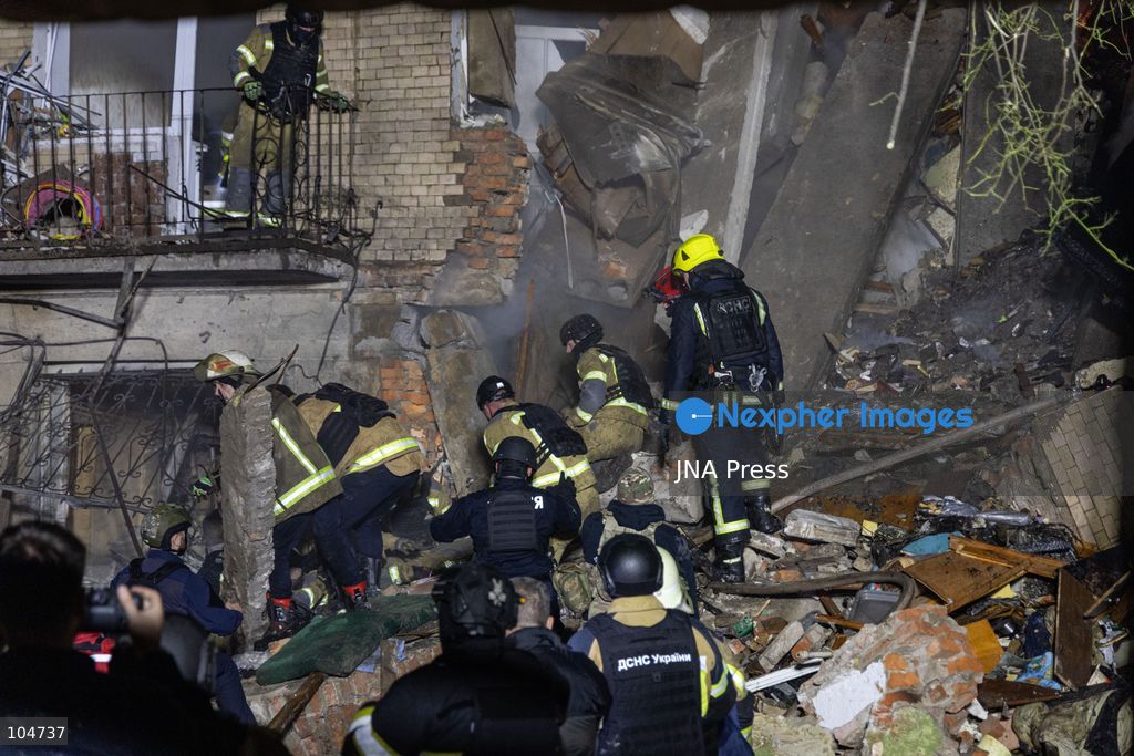 KHARKIV, UKRAINE, OCTOBER 12, 2026: Emergency workers conduct rescue operations at a residential building damaged in a Russian strike in Kharkiv's Kholodnohirskyi district. A firefighter was injured by falling concrete debris while clearing the rubble and was evacuated on a stretcher. Photo by Andrew Cling/ JNA Press. (Photo by Andrew Cling/JNA Press via Nexpher Images)