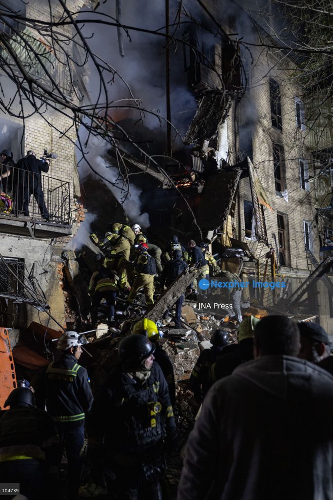 KHARKIV, UKRAINE, OCTOBER 12, 2026: Emergency workers conduct rescue operations at a residential building damaged in a Russian strike in Kharkiv's Kholodnohirskyi district. A firefighter was injured by falling concrete debris while clearing the rubble and was evacuated on a stretcher. Photo by Andrew Cling/ JNA Press. (Photo by Andrew Cling/JNA Press via Nexpher Images)