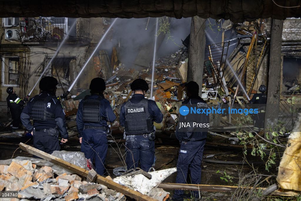 KHARKIV, UKRAINE, OCTOBER 12, 2026: Emergency workers conduct rescue operations at a residential building damaged in a Russian strike in Kharkiv's Kholodnohirskyi district. A firefighter was injured by falling concrete debris while clearing the rubble and was evacuated on a stretcher. Photo by Andrew Cling/ JNA Press. (Photo by Andrew Cling/JNA Press via Nexpher Images)